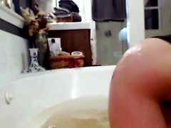 CamSoda - Slender brunette bathes and rubs soap all over