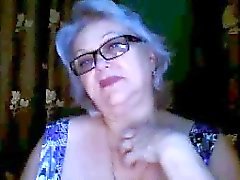 Russian granny ex-teacher flashing her big tits on webcam
