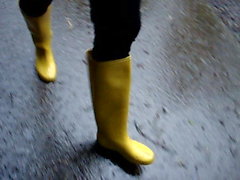 In long Zivalco Rubberboots and barefoot on Street and River