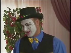 Clown fucks a pierced girl with latex boots